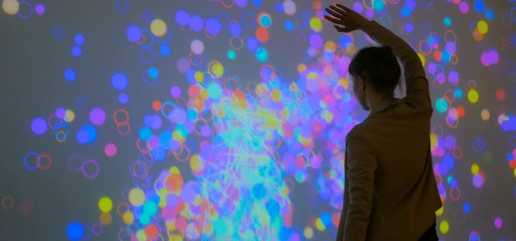 Woman looking at colourful lights